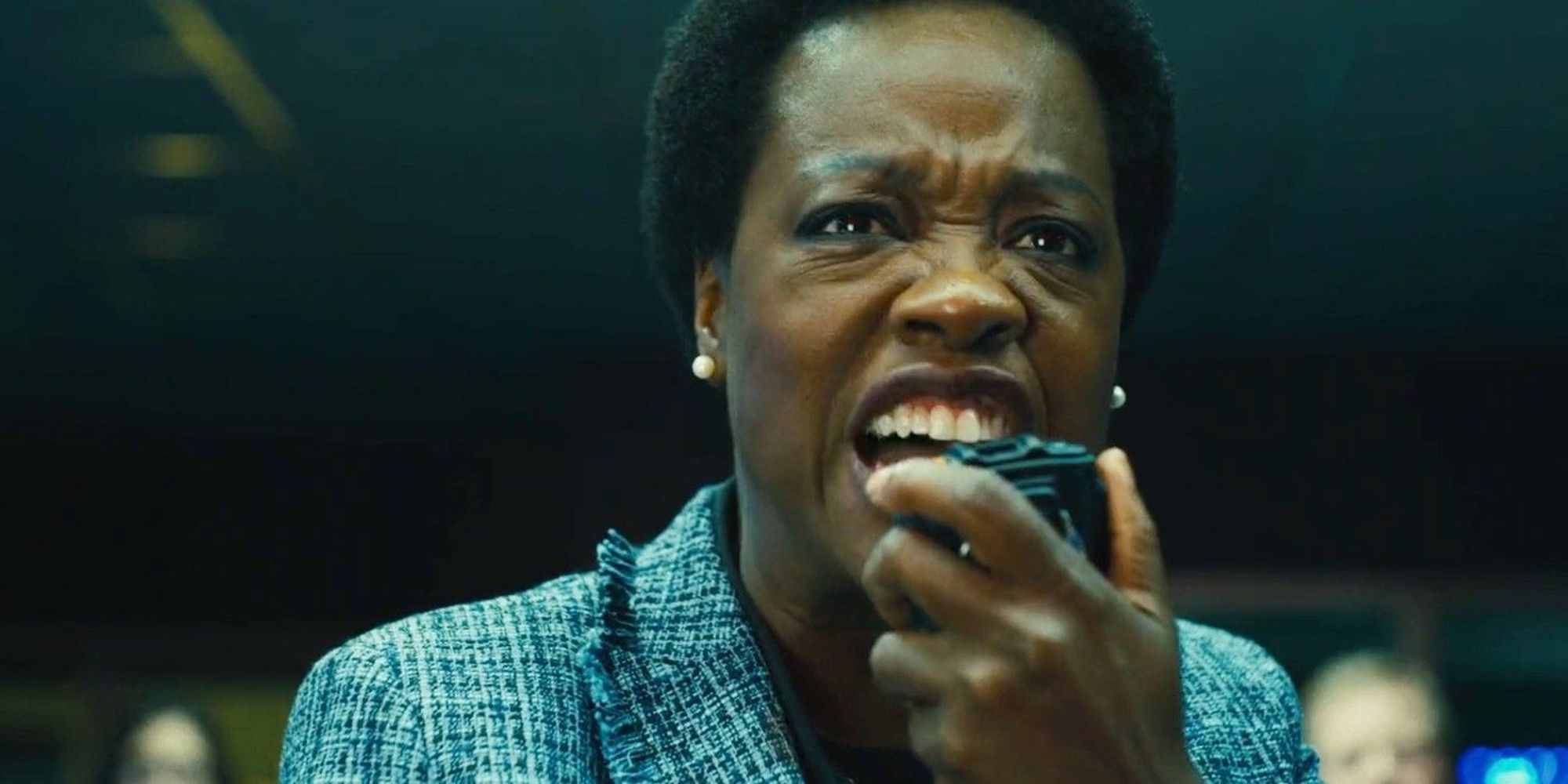 Amanda Waller yelling into a radio to Task Force X in James Gunn's The Suicide Squad (2021)