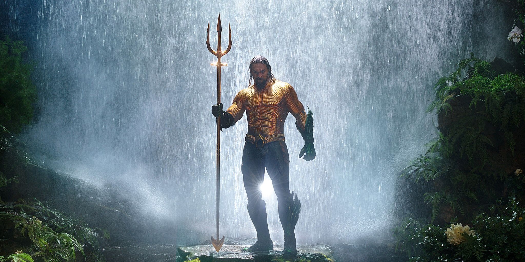Aquaman holds a trident 