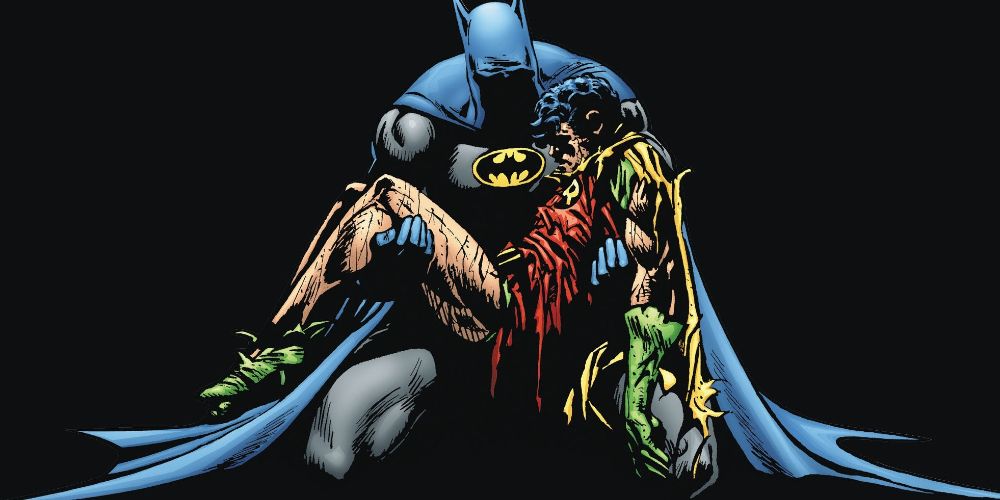Batman holds Jason Todd's body across his chest