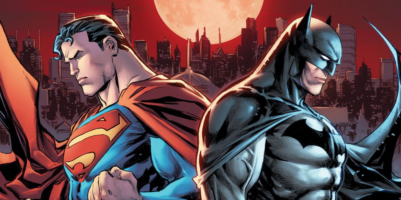 Superman and Batman standing back to back in front of a city