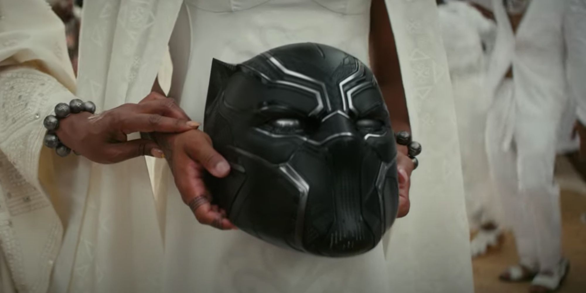 Someone holds T'Challa's Black Panther's mask