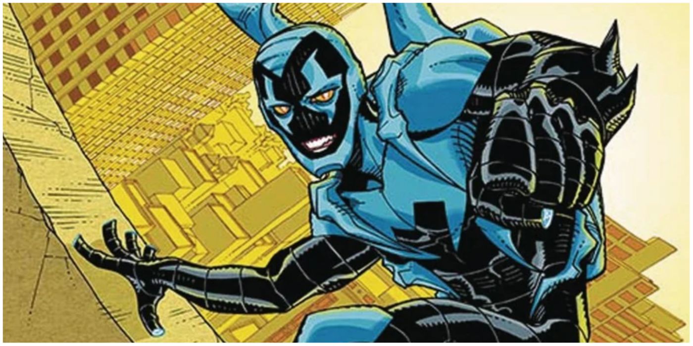Blue Beetle climbing a building in DC comics