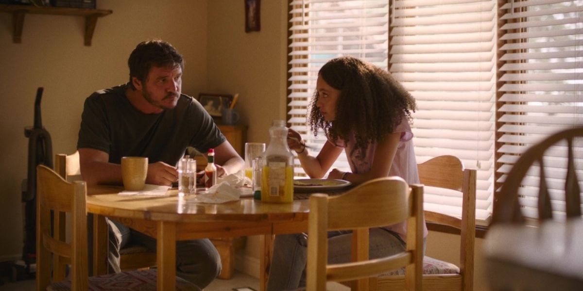 Joel and Sarah eat breakfast in HBO's The Last of Us.