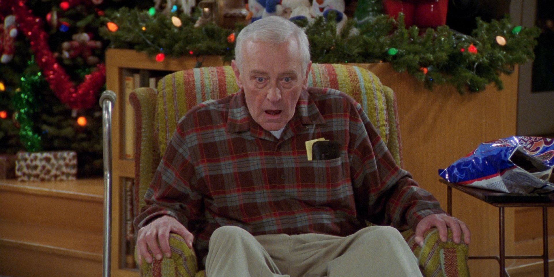 Martin Crane watching television in "High Holidays" on Frasier