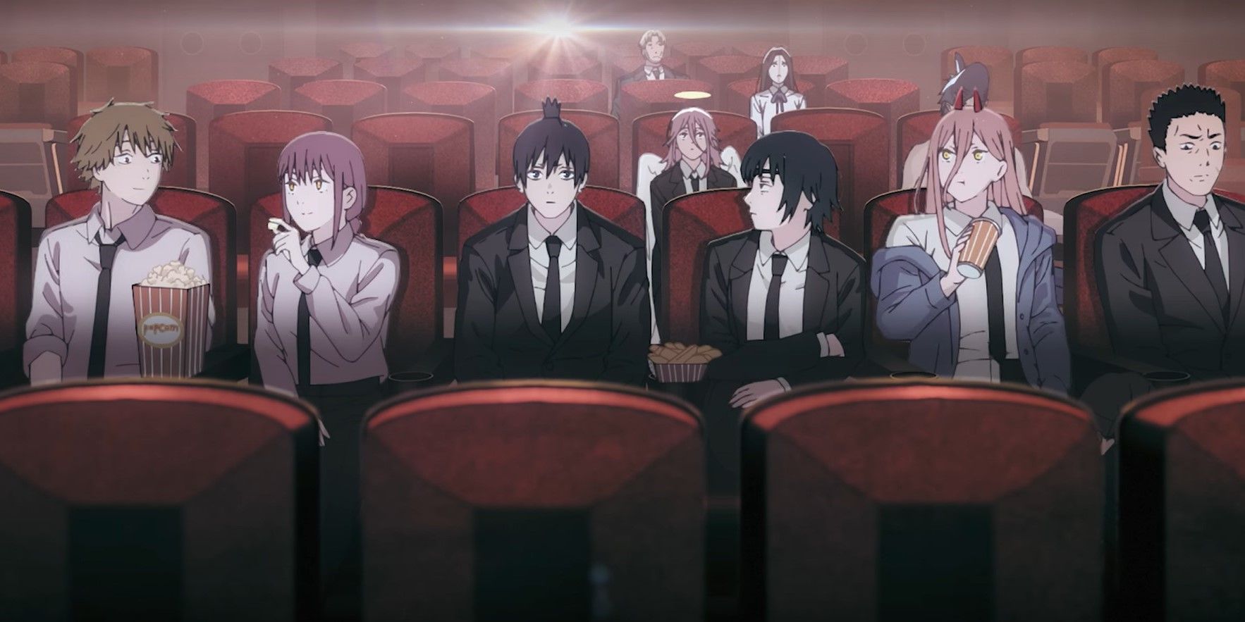 Denji and friends watch a movie in the theater during the opening credits of Chainsaw Man.