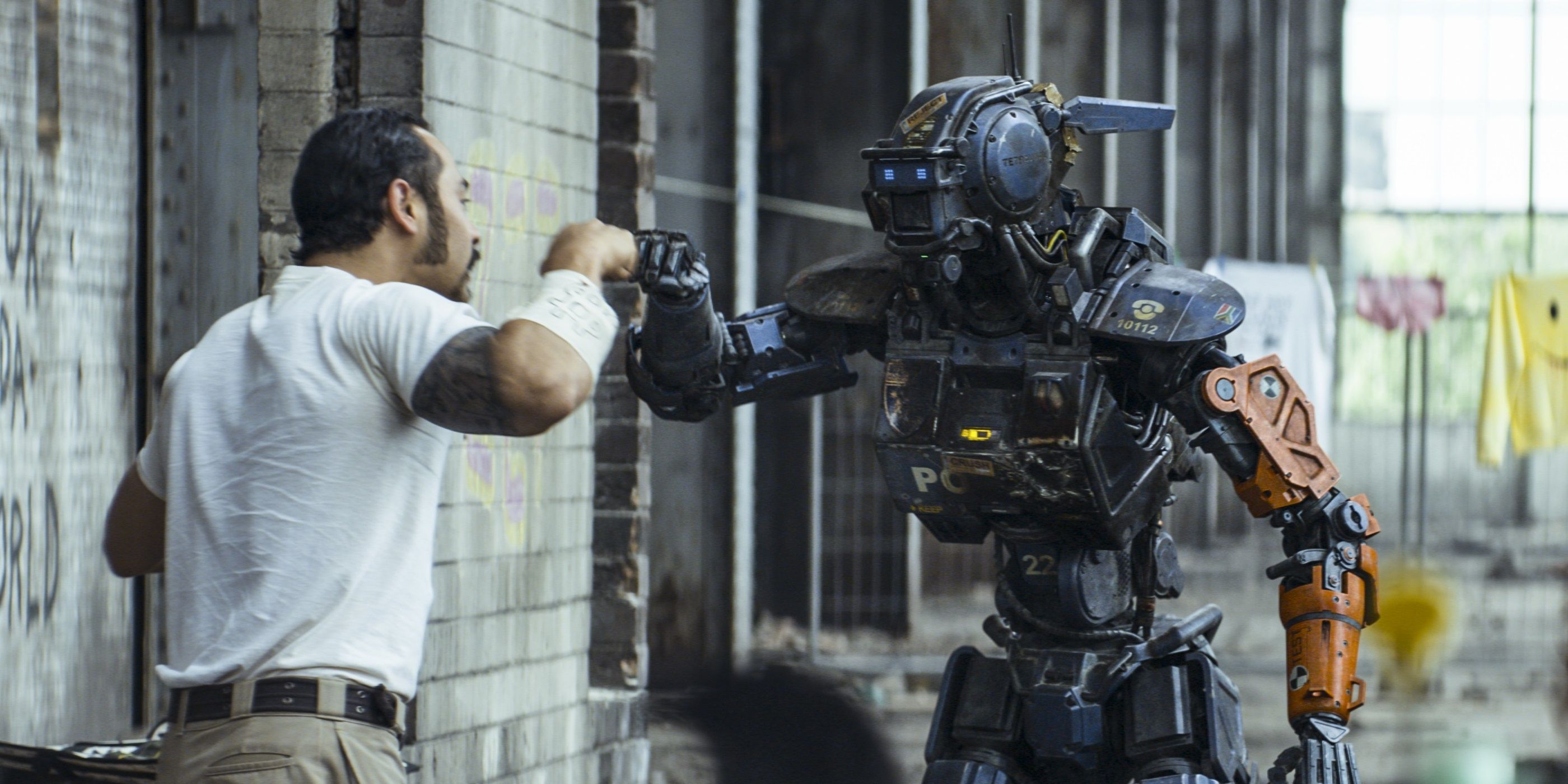 The titular robot Chappie fist bumping in the movie.