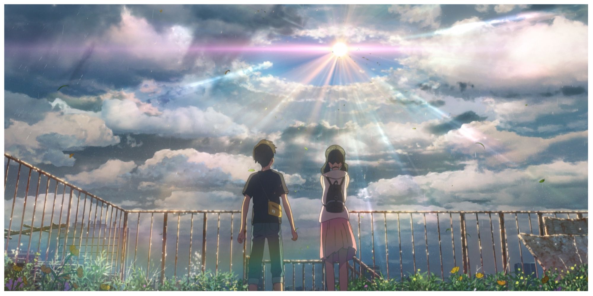 Hodaka and Hina look at the sun in Weathering With You.