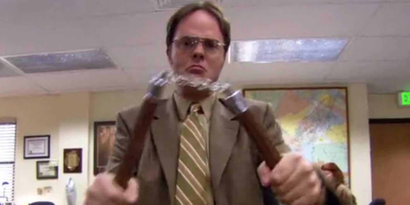 Dwight Schrute holding weapons in The Office