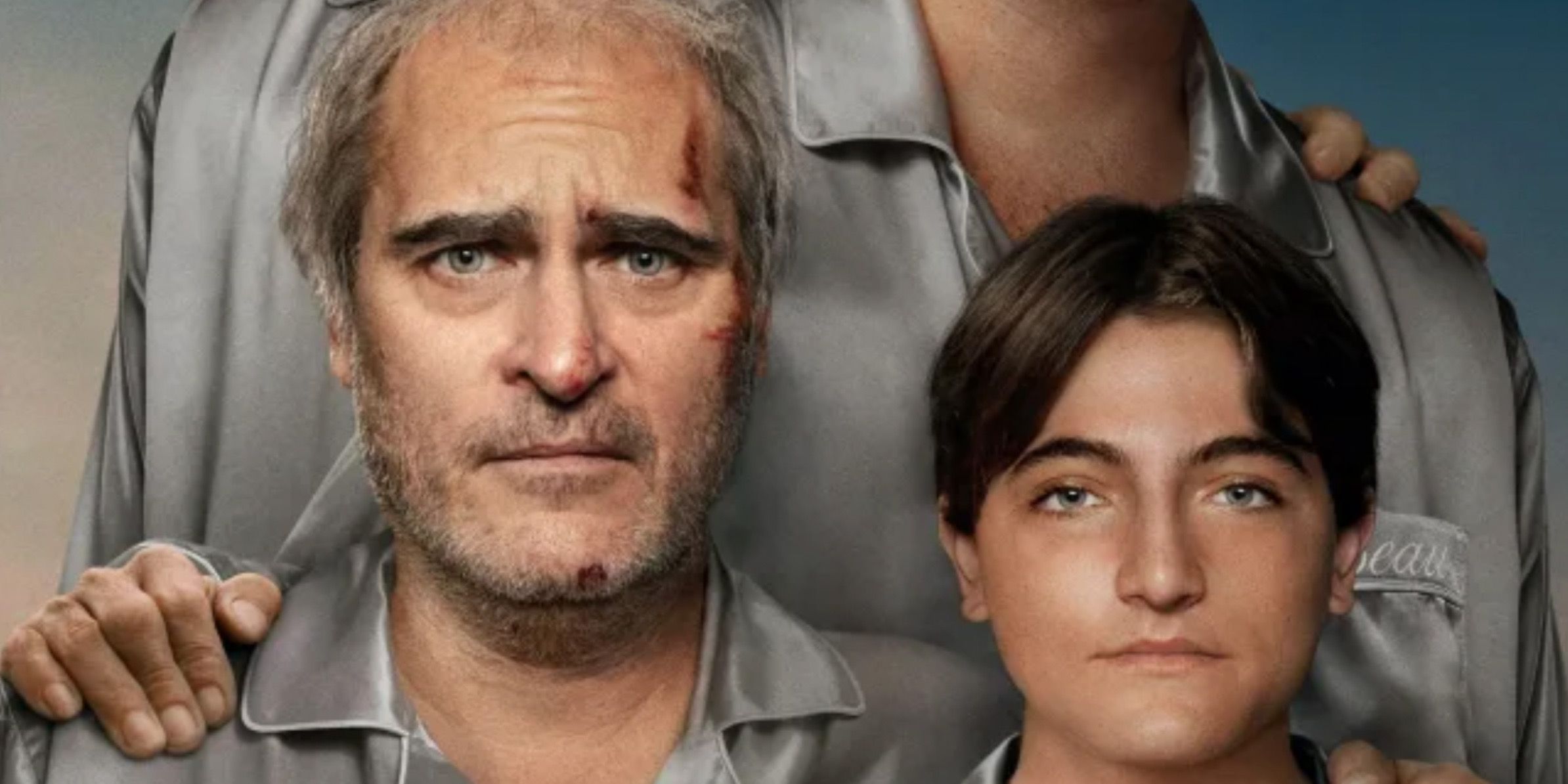 Joaquin Phoenix looking slightly bloody and concerned and Armen Nahapetian with a neutral expression in the Beau is Afraid poster.