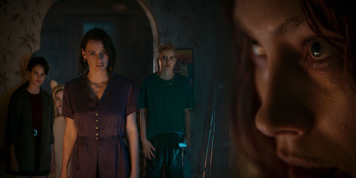 Beth, Danny, Bridget and Kassie looking surprised next to a close up of Ellie from Evil Dead Rise.