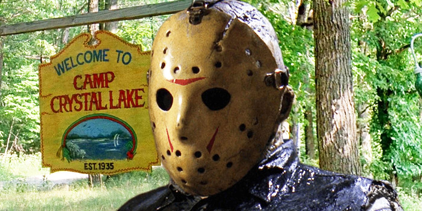 Jason Voorhees in front of a Friday the 13th Camp Crystal Lake sign.