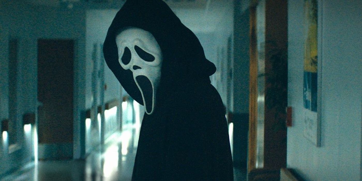 Ghostface in Scream standing in a hallway