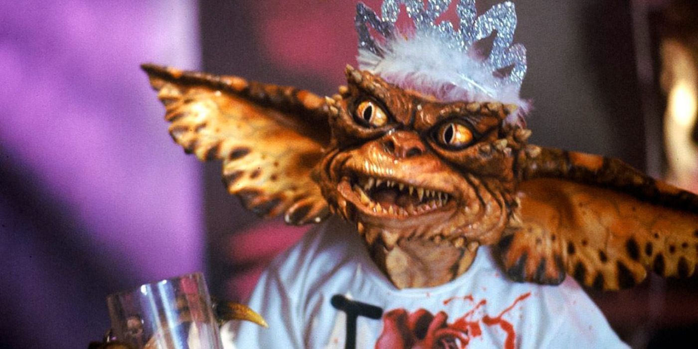 A gremlin wearing a crown and t-shirt in Gremlins.