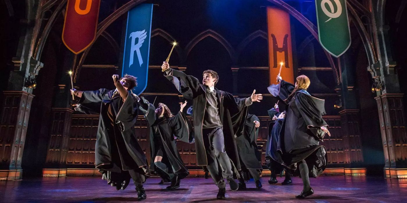 Students brandish their wands under Hogwarts banners in Harry Potter and the Cursed Child