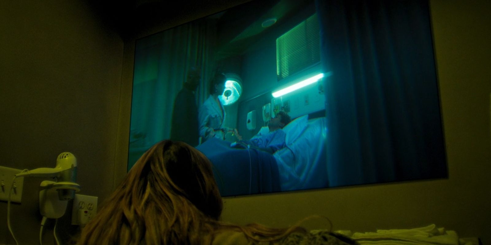 In the motel mirror, Blake sees Everett and his parents at the hospital on Wolf Pack