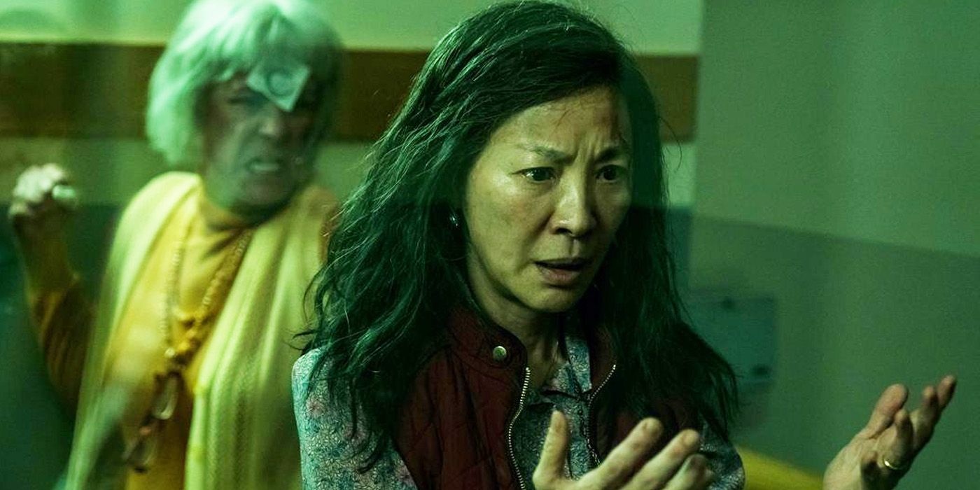 Michelle Yeoh's Evelyn Wang phasing in Everything Everywhere All at Once as Jamie Lee Curtis tries ot punch her..