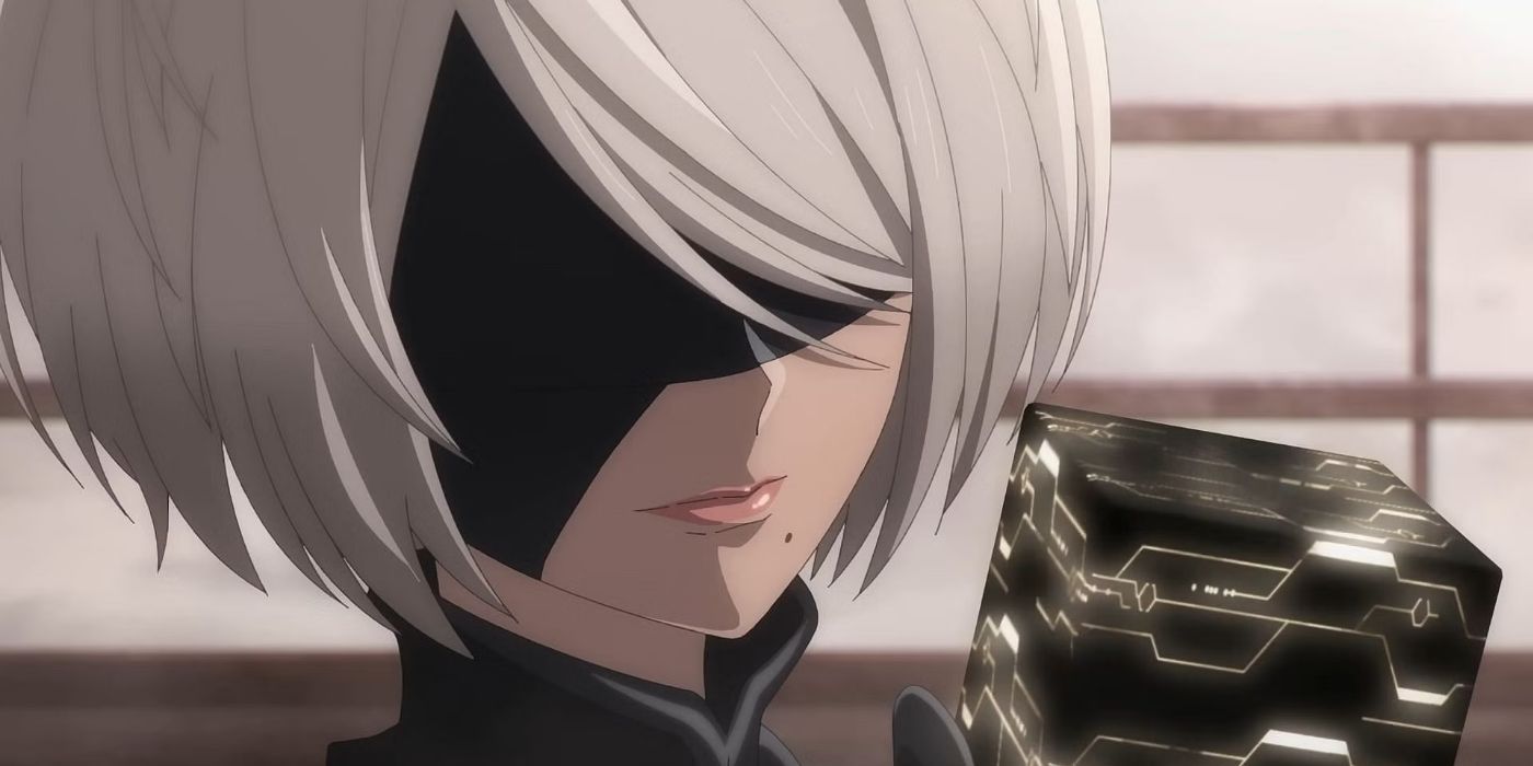 2B from Nier Automata holding a cube and staring at it.