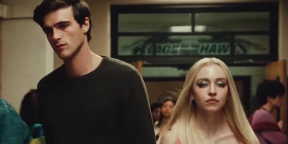 Nate and Cassie walk down hall together - Euphoria