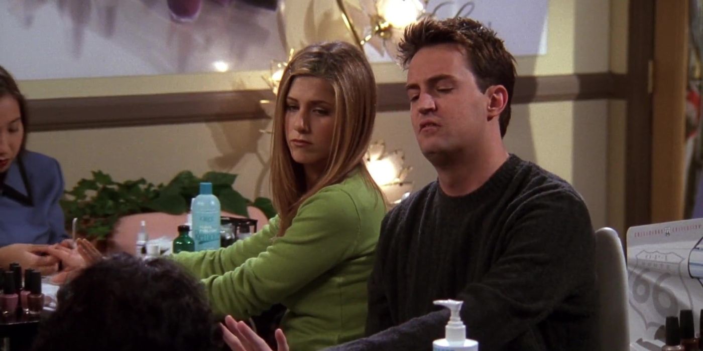 Rachel Green sitting with Chandler Bing in Friends