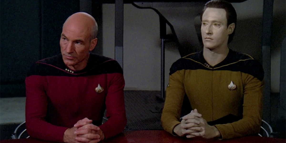 Captain Picard And Data sit at Data's Trial on "The Measure of a Man" episode on Star Trek: The Next Generation.