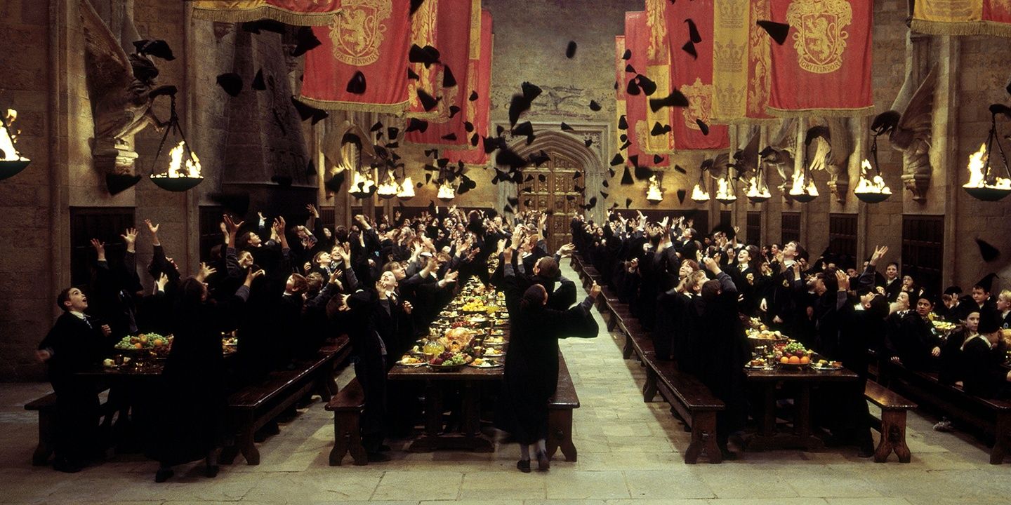 Students throw caps in the air in Harry Potter 