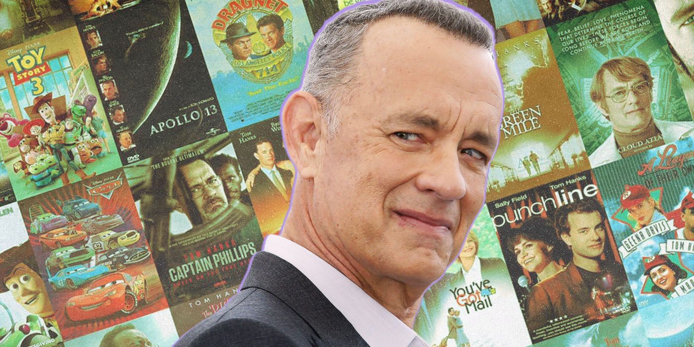 Tom Hanks positioned in front of a collage of his movie posters.