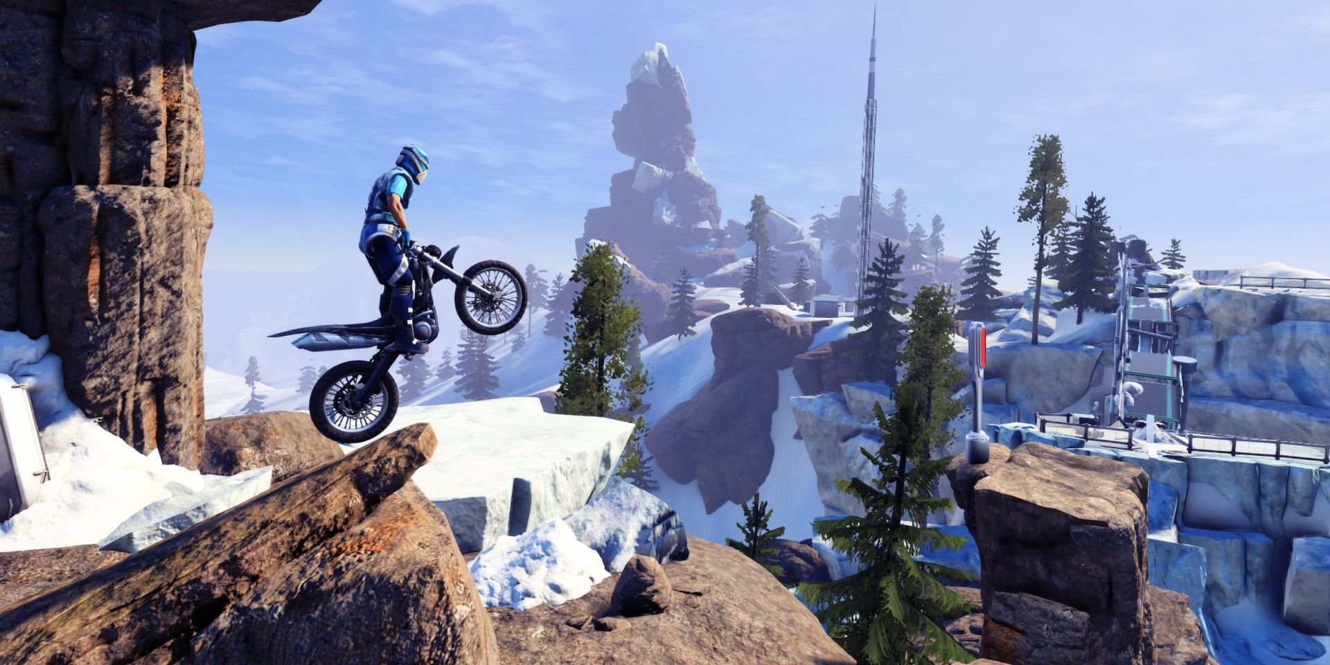 Players rides off ramp along a snowy mountain setting in Trials Fusion
