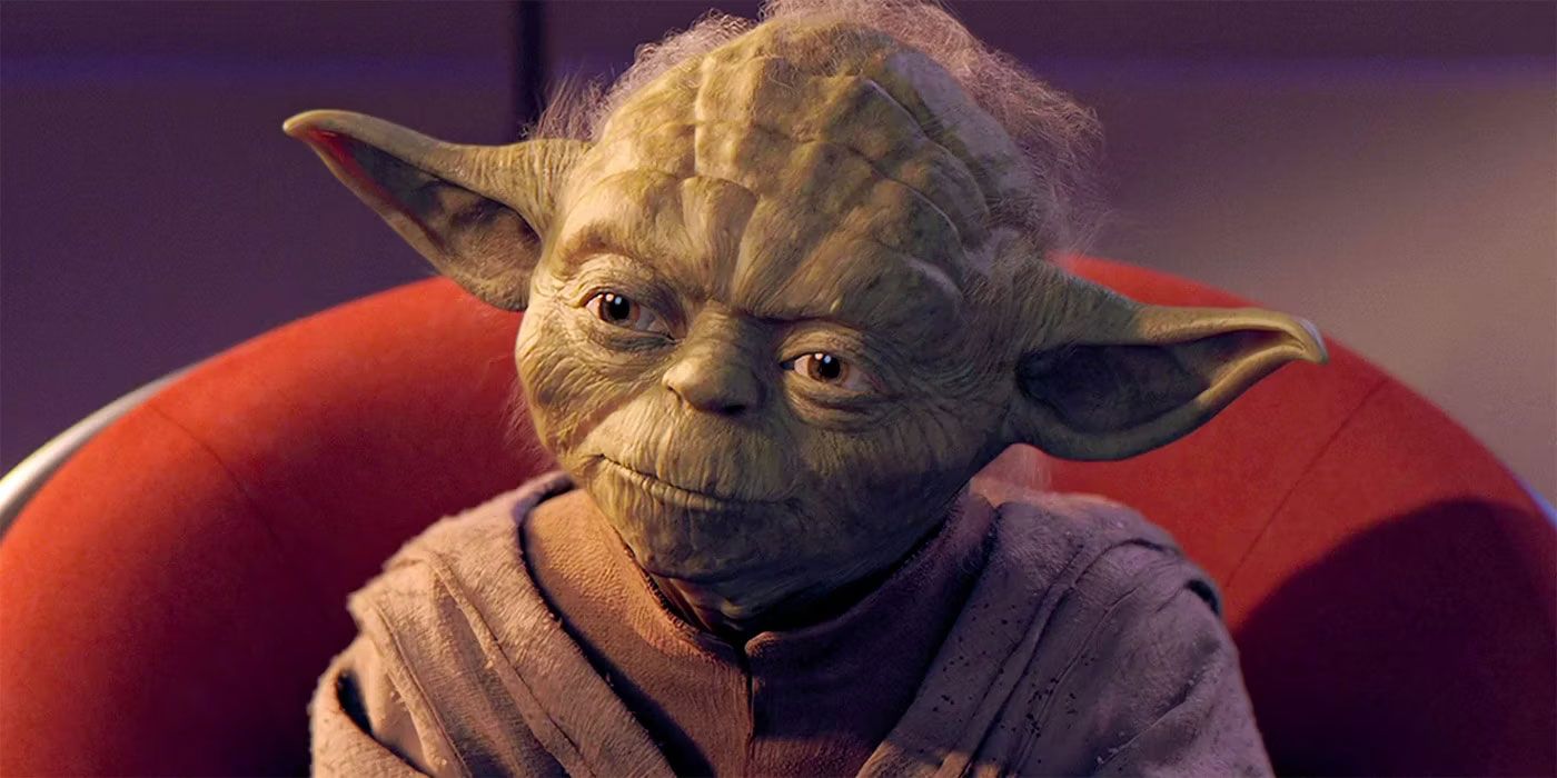 Yoda sitting in a red chair in the Jedi Council room in The Phantom Menace.