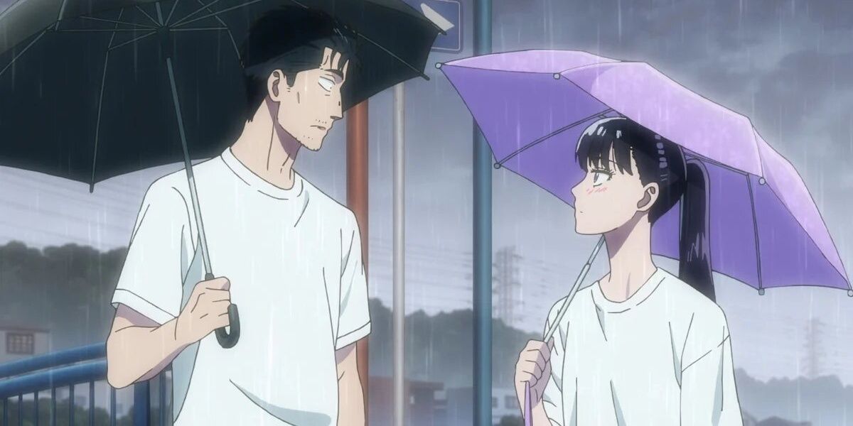 Akira and Kondou staring at each other while it rains in the anime After the Rain