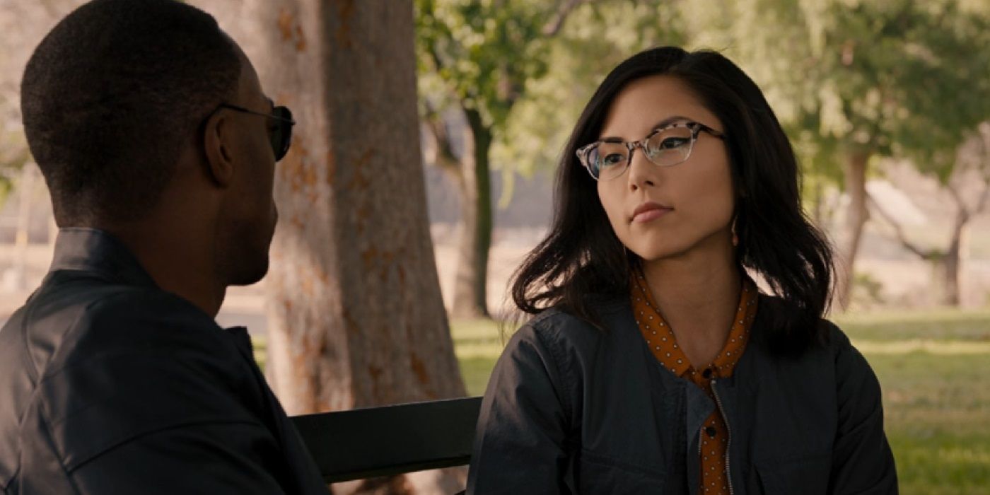 Anna Akana and Anthony Mackie sitting on a bench in Ant-Man