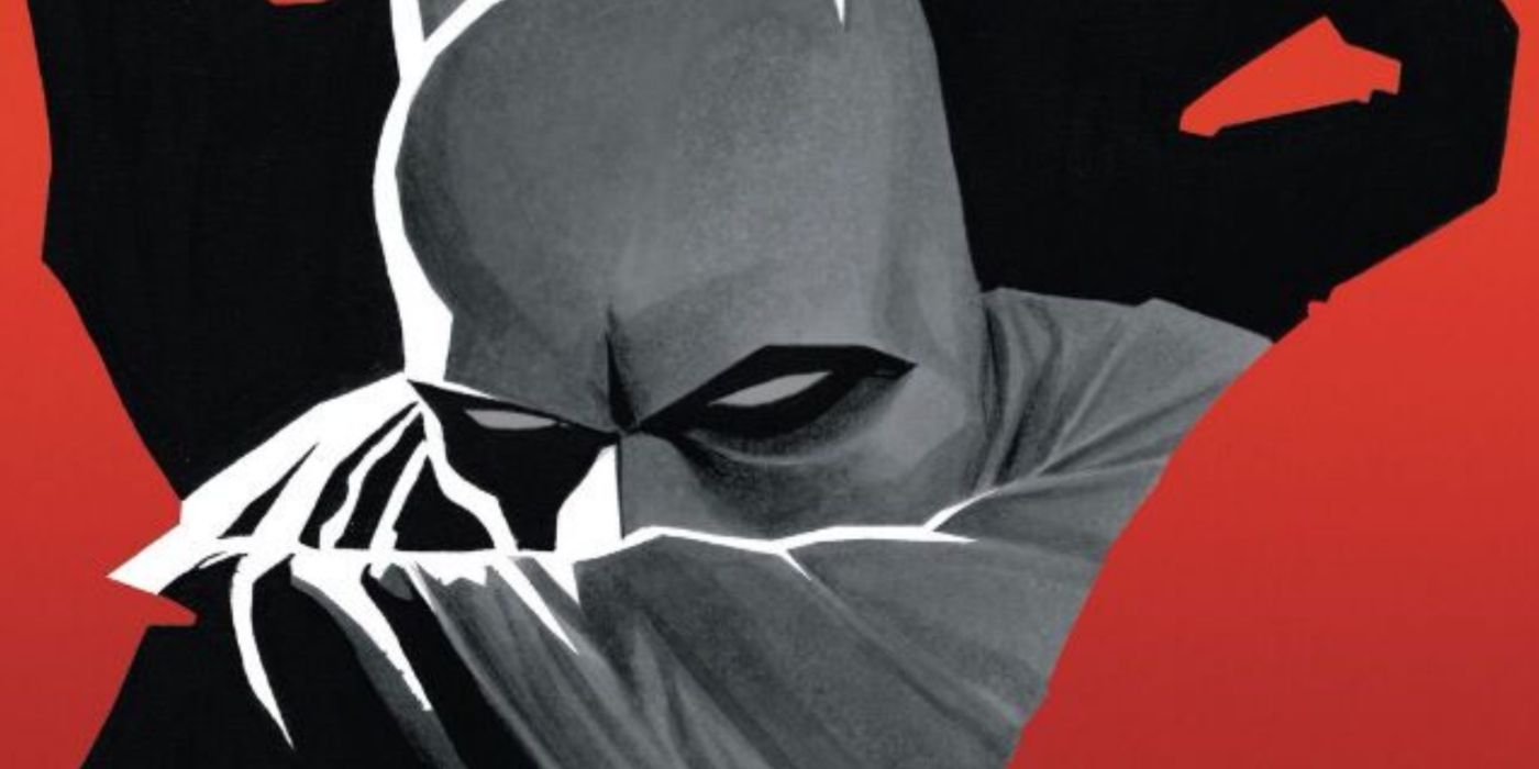 Batman shrouding himself with his cape in DC Comics