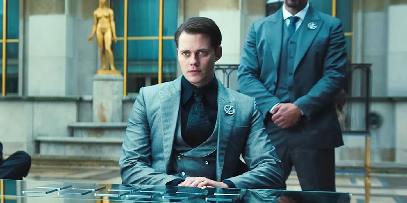 Bill Skarsgard as The Marquis sitting down at a meeting in John Wick Chapter 4.