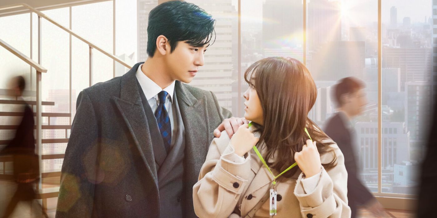 photo of the main characters from business proposal. shin ha-ri is walking away as kang tae-mu grabs her shoulder and makes her look back.