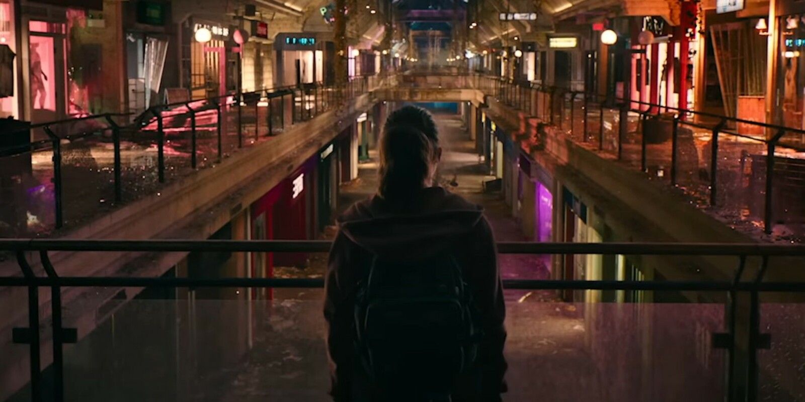 Ellie looks on at the illuminated mall in episode seven of HBO's The Last of US