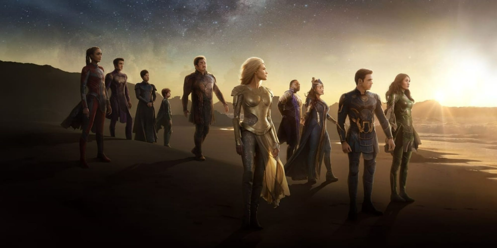 The MCU's Eternals stand together on a beach during a sunset.
