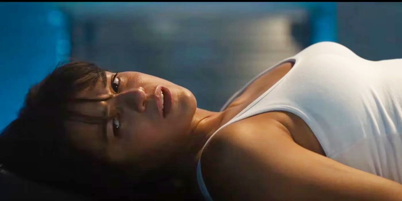 Michelle Rodriguez on a table as Letty in the Fast X trailer.