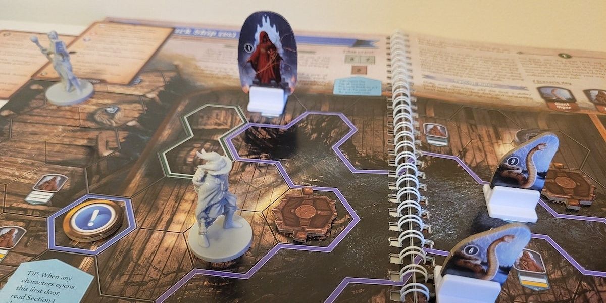 Two players fighting enemies in Gloomhaven: Jaws of the Lion board game