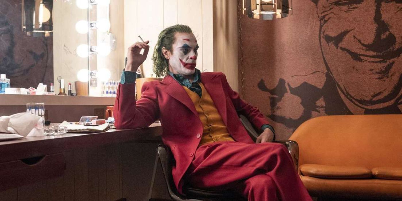 joaquin phoenix as the joker sitting in a dressing room of the murray franklin show