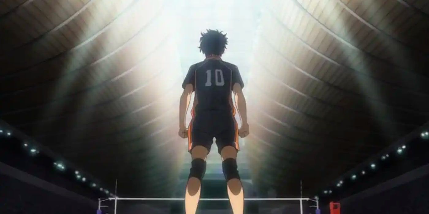 Back view of the mysterious Tiny Giant standing in a dimly lit volleyball arena from Haikyuu!!