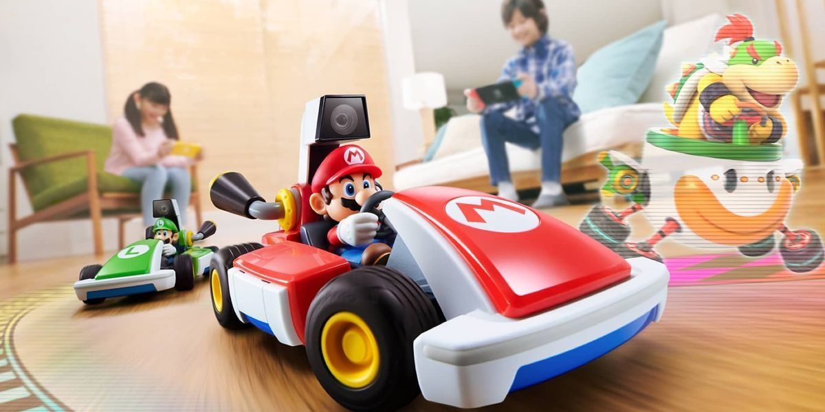 Uma imagem promocional de Mario Kart Live: Home Circuit apresentando Mario, Luigi e Bowser Jr.