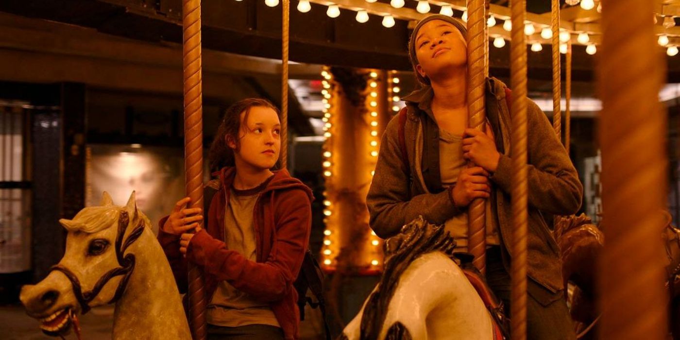 Ellie looks at Riley on the carousel at the mall in HBO's The Last of Us.