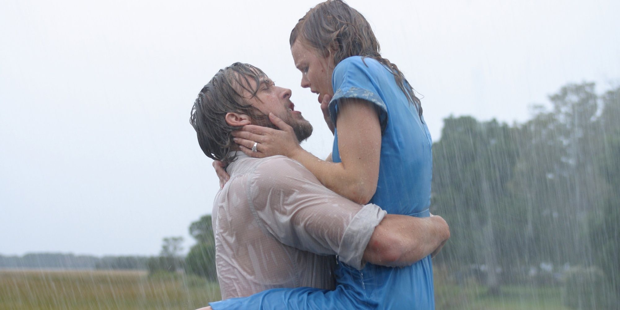 Noah and Allie from The Notebook kissing in the pouring rain.