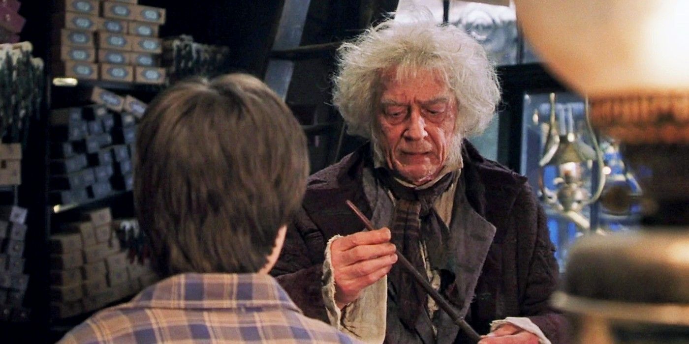 Ollivander holding a wand in front of Harry