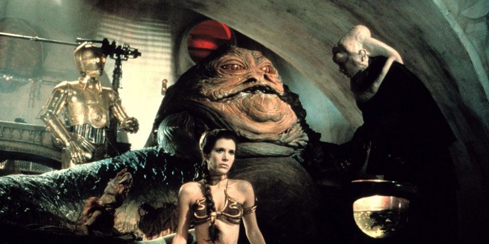 Princess Leia captured by Jabba the Hutt and wearing a gold bikini in Star Wars: Return of the Jedi