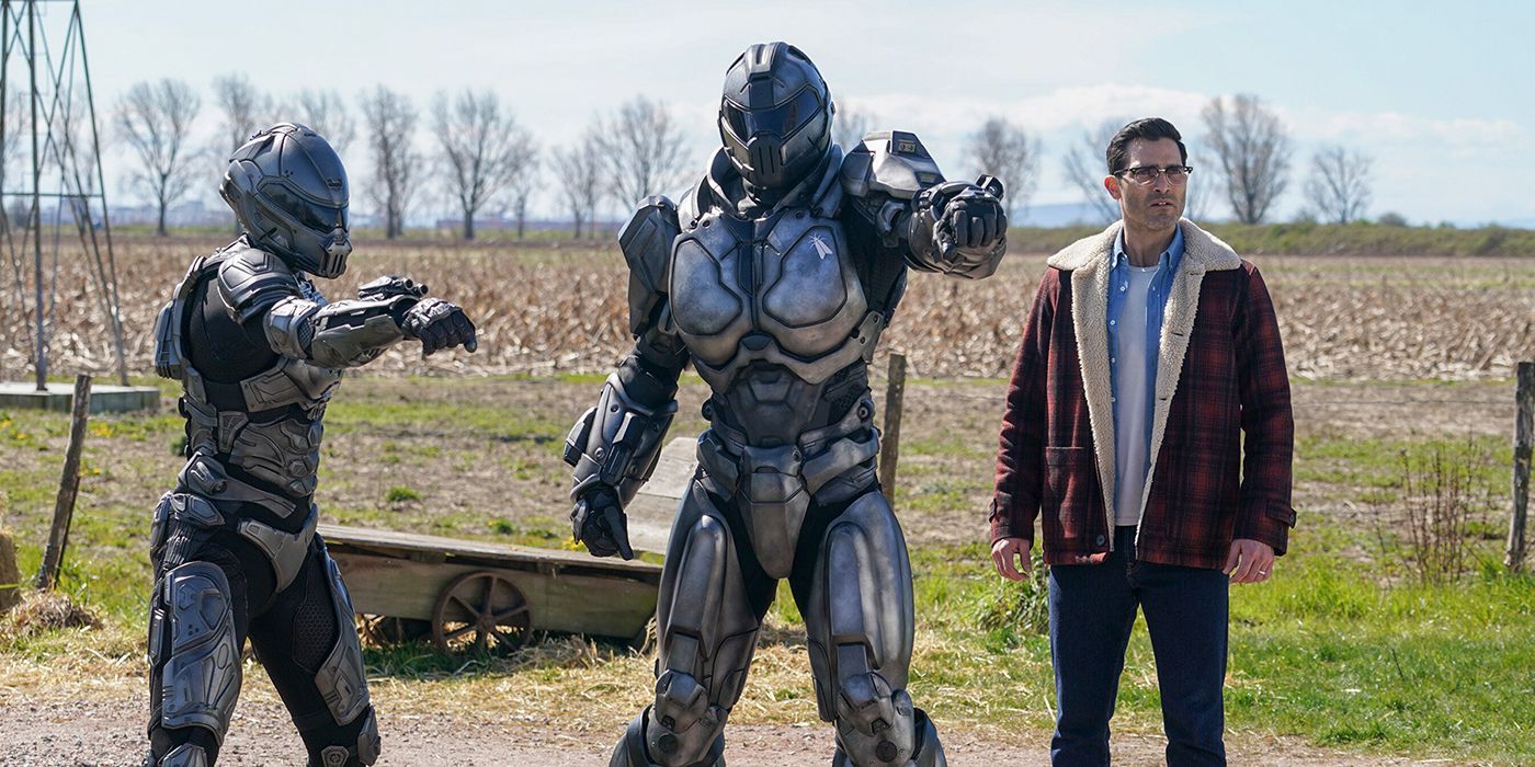 Natalie and John Henry Irons in their exosuits next to Clark Kent on Superman and Lois