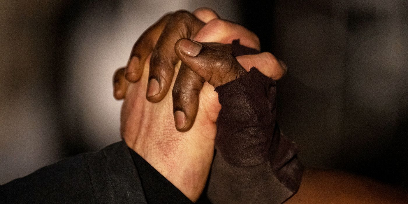 Rick (Andrew Lincoln) and Michonne (Danai Gurira) holding hands in The Walking Dead