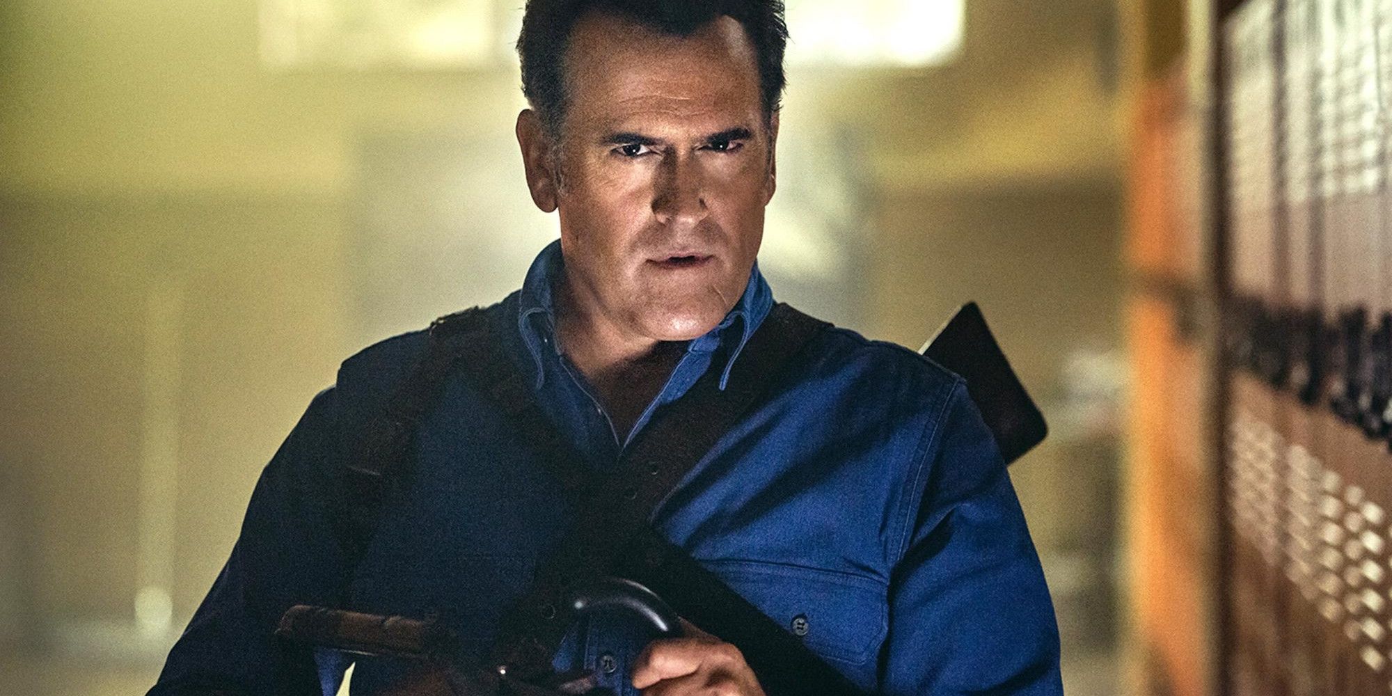 Bruce Campbell looking cooly at the camera as Ash Williams in Evil Dead.