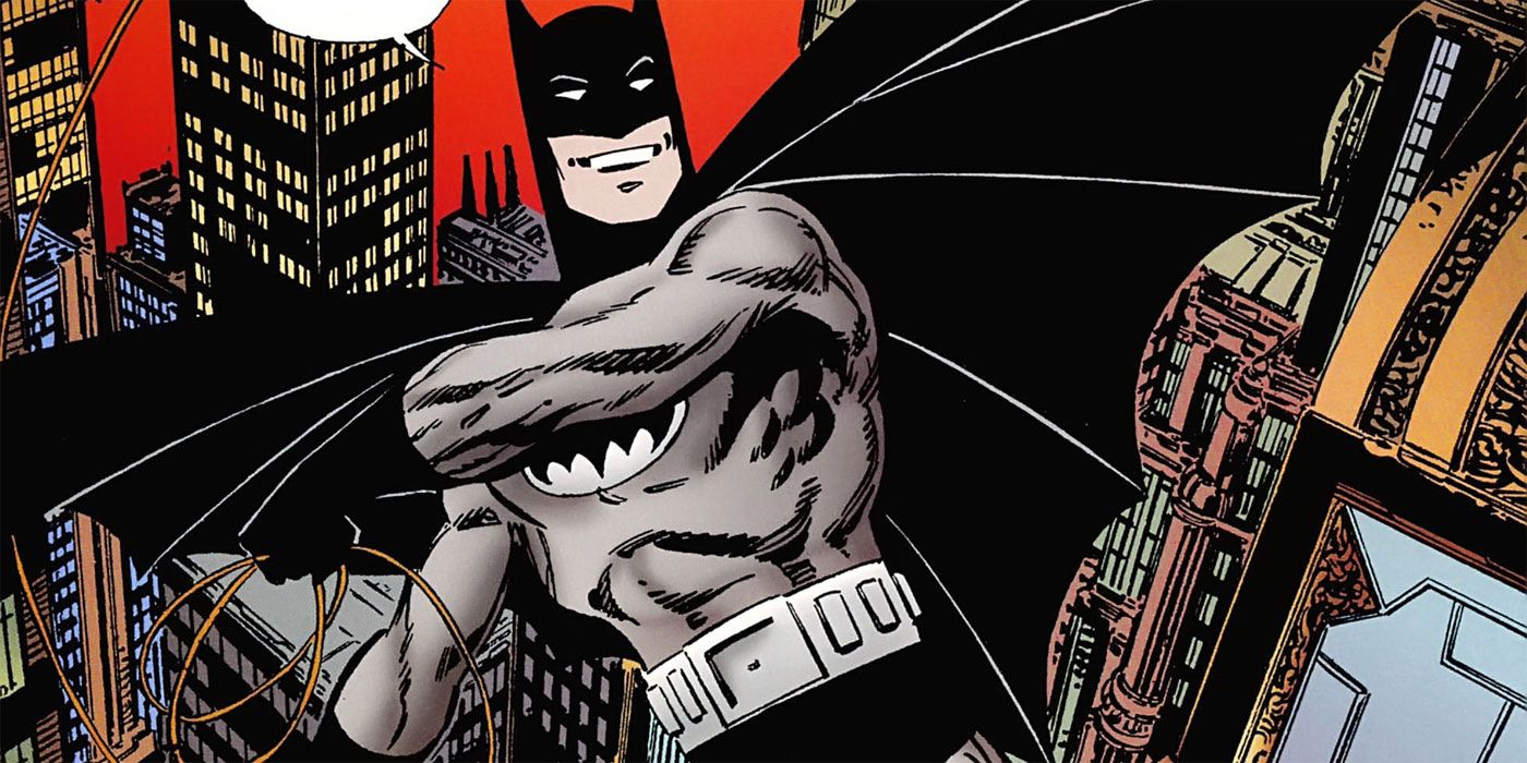 Immortal Batman swings over Gotham City in a monochrome costume in DC Comics.