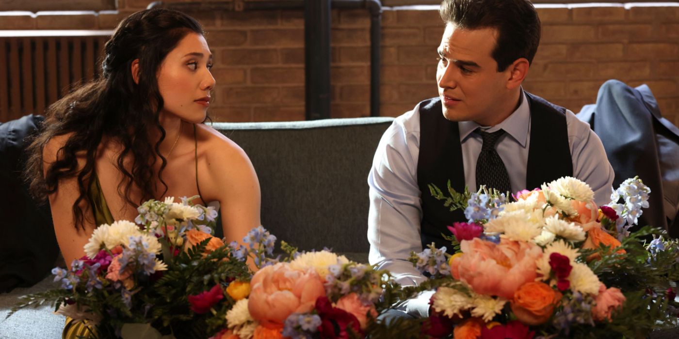 Violet and Gallo sit at a table full of flowers