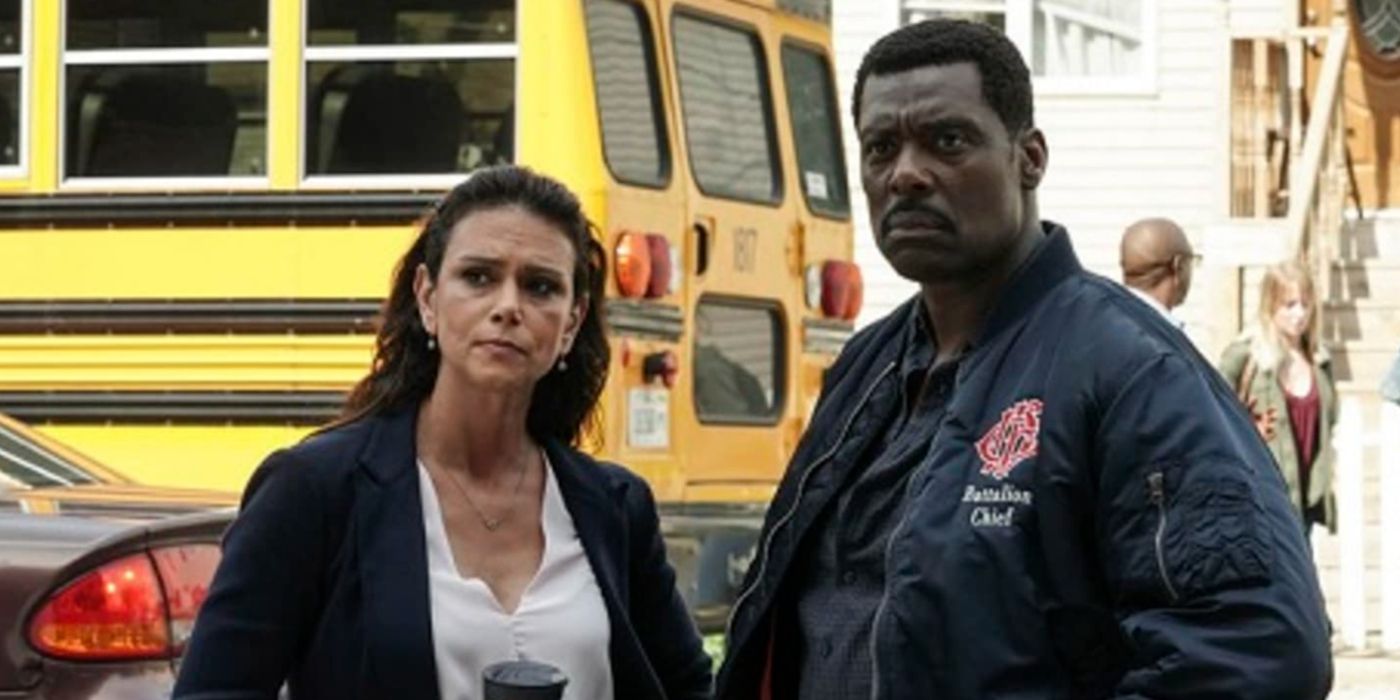 Donna and Chief Boden on Chicago Fire look off camera concerned